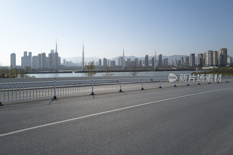 city ​​buildings beside asphalt road